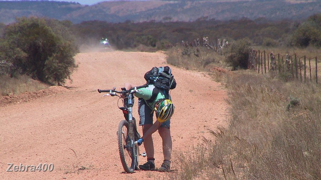 07-Heidi makes adjustments to her MTB.JPG